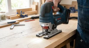 Built-in LED work light illuminating the pencil cutting line on a wooden board