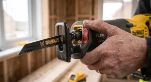 Tradesperson fitting a wood blade using the tool-free lever clamp on a multi-voltage reciprocating saw